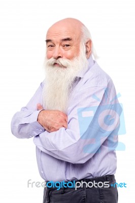 Senior Man Standing Sideways To Camera Stock Photo