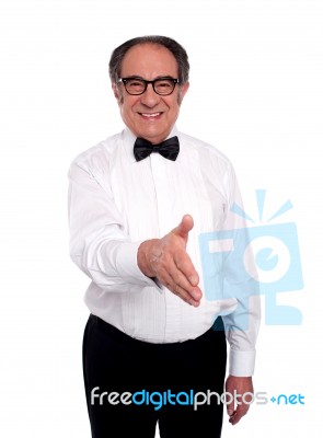 Senior Man Welcome With Smile Stock Photo