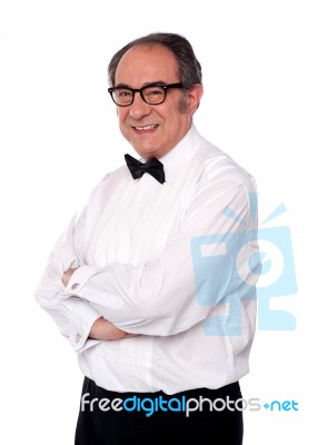 senior man With Crossed Arms Stock Photo