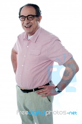 Senior Man With Hands On Waist Stock Photo