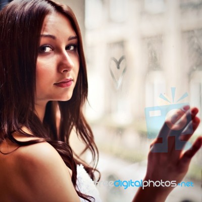 Sensual Girl With Heart On Window Stock Photo