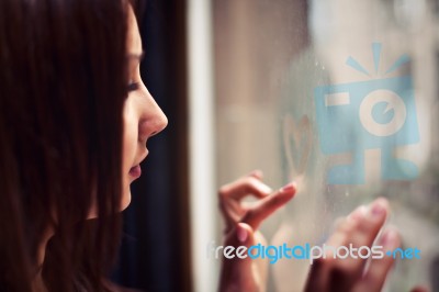 Sensual Girl With Heart On Window Stock Photo