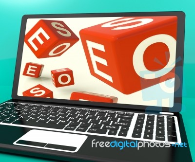 Seo Dice On Laptop Showing Online Web Optimization Stock Image