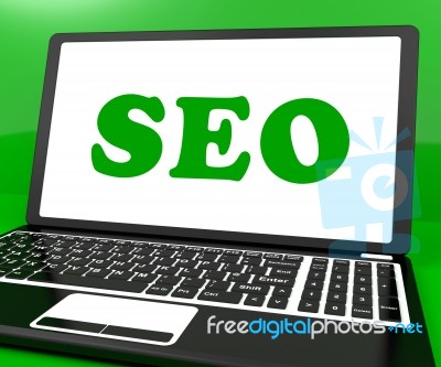 Seo On Laptop Shows Search Engine Optimization On Internet Stock Image