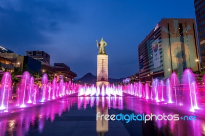 Seoul, South Korea - April 30, 2016:beautifully Color Water Fountain At Gwanghwamun Plaza With The Statue Of The Admiral Yi Sun-sin In Downtown.photo Taken On April 30,2016 In Seoul,south Korea Stock Photo