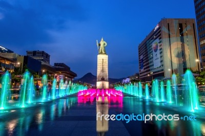 Seoul, South Korea - April 30, 2016:beautifully Color Water Fountain At Gwanghwamun Plaza With The Statue Of The Admiral Yi Sun-sin In Downtown.photo Taken On April 30,2016 In Seoul,south Korea Stock Photo