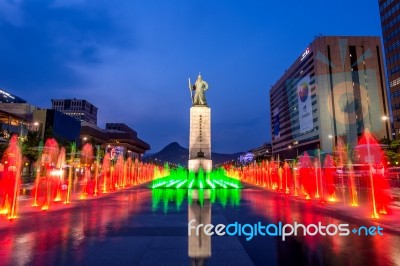 Seoul, South Korea - April 30, 2016:beautifully Color Water Fountain At Gwanghwamun Plaza With The Statue Of The Admiral Yi Sun-sin In Downtown.photo Taken On April 30,2016 In Seoul,south Korea Stock Photo