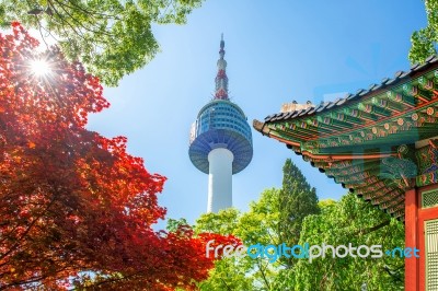 Seoul Tower With Gyeongbokgung Roof And Red Autumn Maple Leaves At Namsan Mountain In South Korea Stock Photo