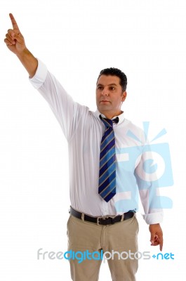 Serious Businessman Pointing Sideway Stock Photo