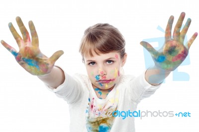 Serious Faced Girl With Painted Hands Stock Photo