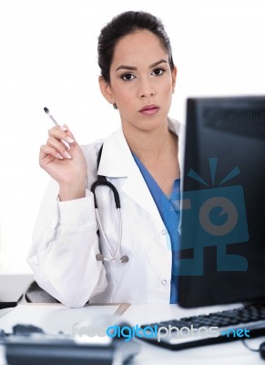 Serious Young Doctor Looking Strangely At Us Stock Photo