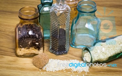 Sesami Seed And Rice In Bottles Stock Photo