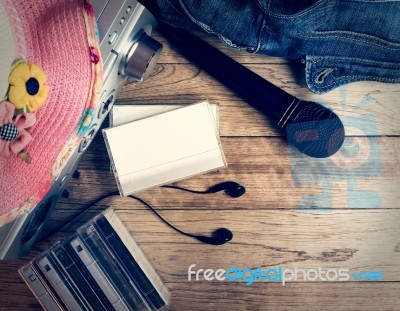 Set Of Audio Device On Wooden Background Stock Photo