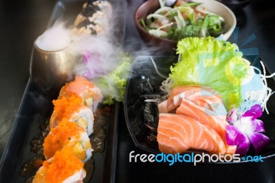 Set Of Salmon Menu Served On Black Plate Stock Photo