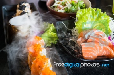 Set Of Salmon Menu Served On Black Plate Stock Photo