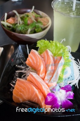 Set Of Sliced Salmon Sashimi And Green Tea Stock Photo