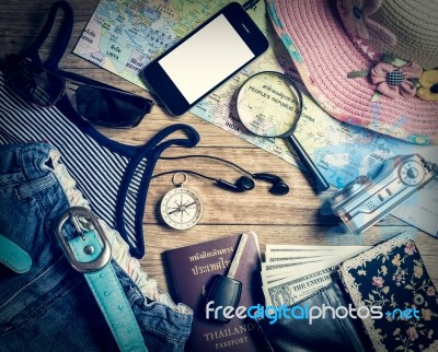 Set Of Travel Accessory On Wooden Background Stock Photo