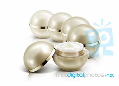 Several Golden Sphere Cosmetic Jar On White Background Stock Photo