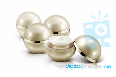 Several Golden Sphere Cosmetic Jar On White Background Stock Photo