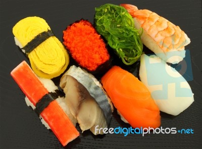 Several Type Sushi Food On Black Plate Stock Photo