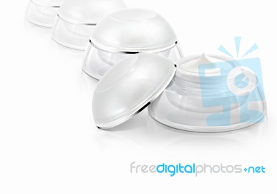 Several White Rounded Cosmetic Jar On White Background Stock Photo