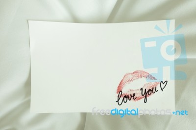 Sexy Red Lipstick Kiss 'love You' Heart On White Note On White Bed Pillow Sheet In The Morning Light, Valentine's Day Stock Photo