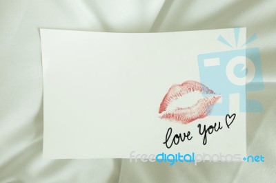 Sexy Red Lipstick Kiss 'love You' Heart On White Note On White Bed Pillow Sheet In The Morning Light, Valentine's Day Stock Photo