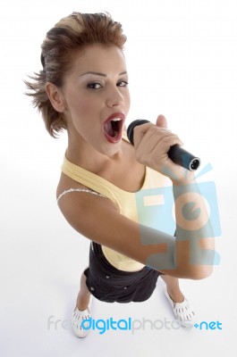 Sexy Woman Singing In Microphone Stock Photo