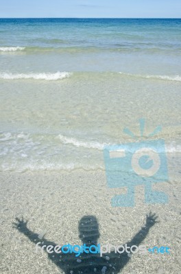 Shadow Man On Beach Stock Photo