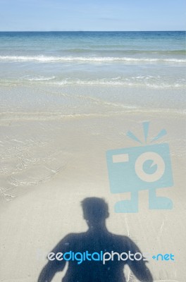 Shadow Man On Beach Stock Photo