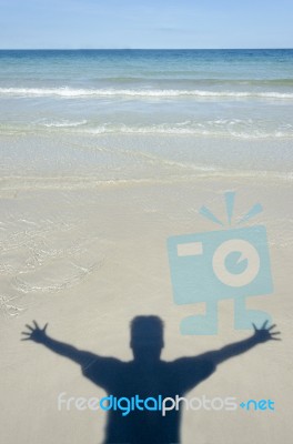 Shadow Man On Beach Stock Photo