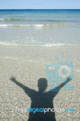 Shadow Man On Beach Stock Photo