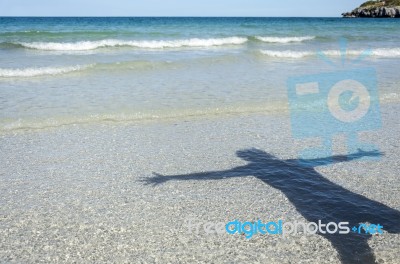 Shadow Man On Beach Stock Photo