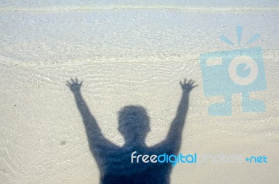 Shadow Man On Beach Stock Photo