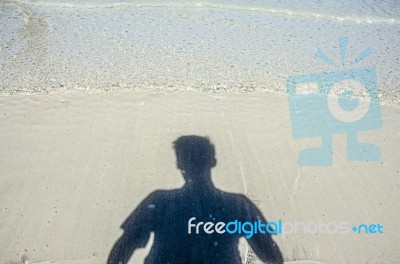 Shadow Man On Beach Stock Photo