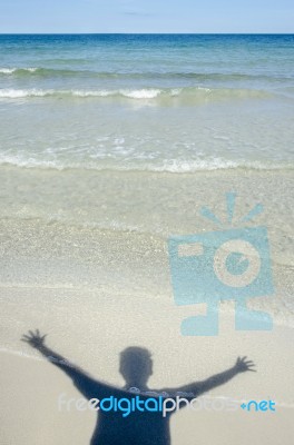 Shadow Man On Beach Stock Photo