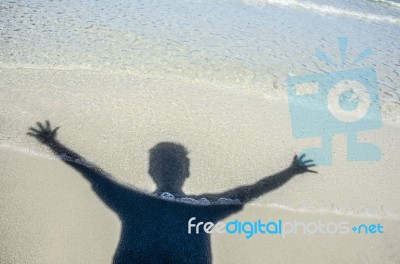 Shadow Man On Beach Stock Photo