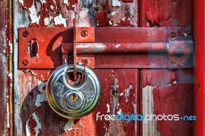 Shiny New Padlock On An Old Door Stock Photo