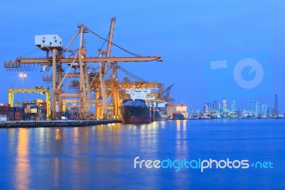 Ship Yard With Heavy Crane In Beautiful Twilight Of Day Stock Photo