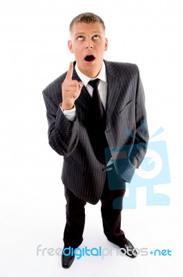 Shocked Businessman Pointing Up Stock Photo