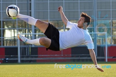 Shoot Of Football Player On The Outdoors Field Stock Photo