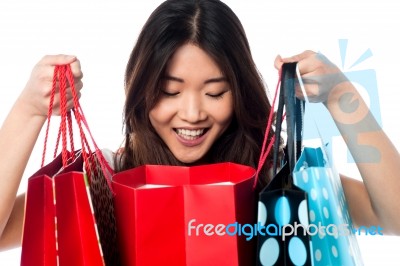 Shopaholic Girl Holding Shopping Bags Stock Photo