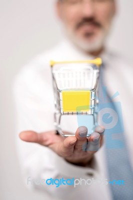 Shopping Cart On Top Of Hands Stock Photo