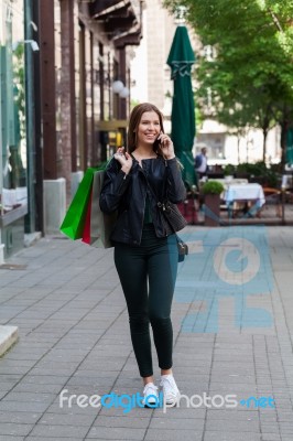 Shopping Woman Talking On The Phone Stock Photo