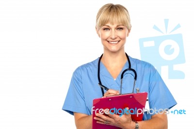 Shot Of A Cheerful Doctor Doing Her Rounds Stock Photo