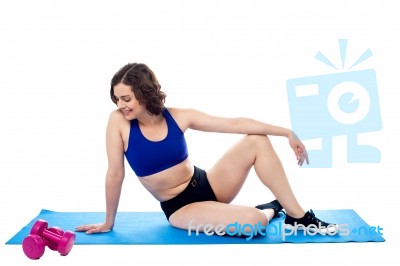 Should I Use Dumbbells Or Not? Lady Thinking Stock Photo