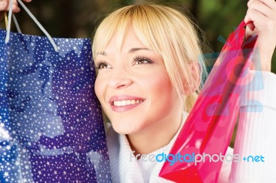 Showing Her Shopping Bags Stock Photo