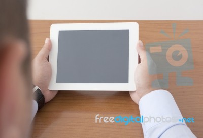 Showing The Digital Tablet On The Table Stock Photo