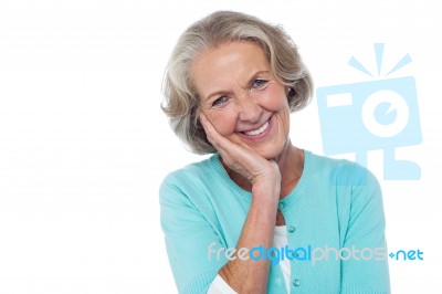 Shy And Polite Senior Smiling Woman Stock Photo