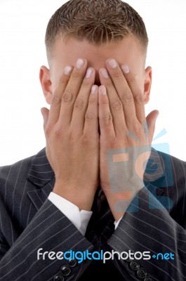 Shy Businessman Hiding His Face Stock Photo